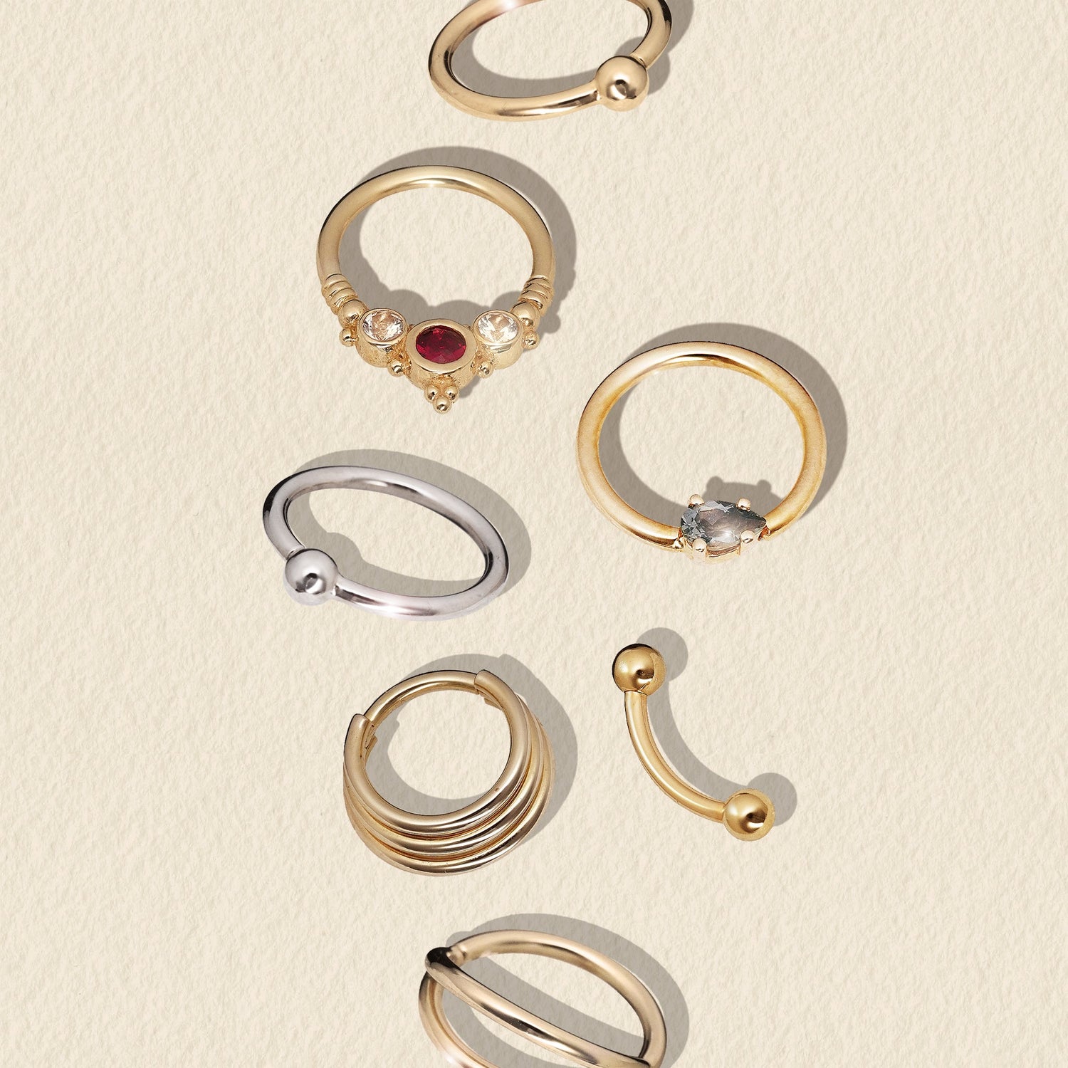 gold seam rings and clickers some with precious stones set in them