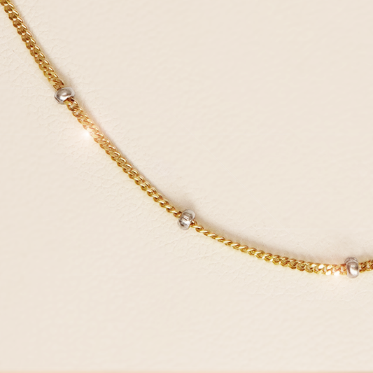 Yellow Gold Station Necklace with White Gold Beads