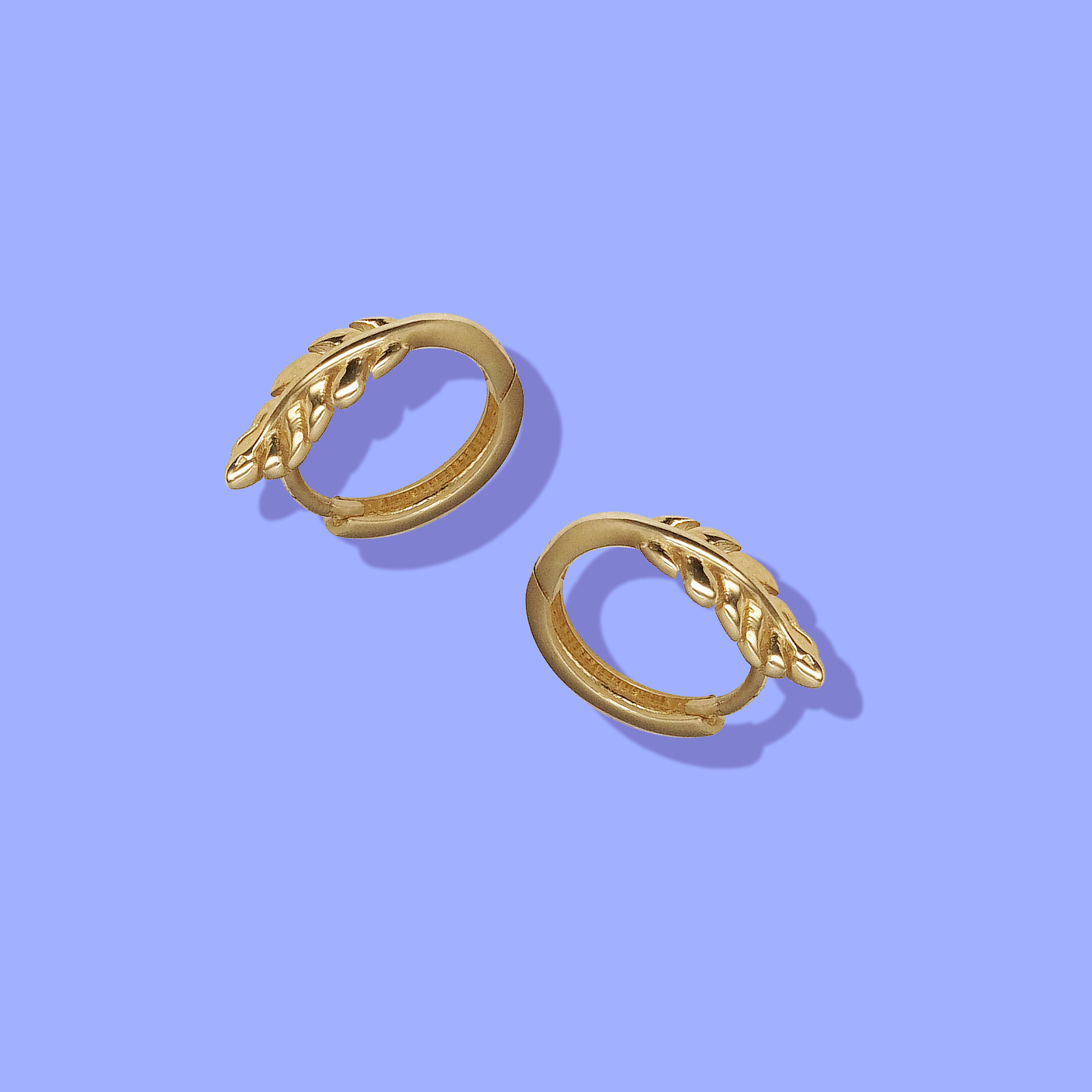 14K Gold Huggie earrings shaped like fern leaves